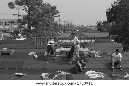 Roofing crew,volunteers in the ninth ward,New Orleans.Aug.23,2005.approx. one year after Hurricane Katrina.
