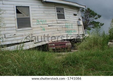 Lower Ninth Ward, New Orleans one year after hurricane Katrina struck the gulf coast. House on Automobile