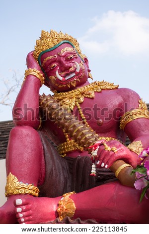 Red guardian statue at the Temple of Thailand