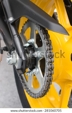 Enduro motorbike wheel and chain. Closeup shot