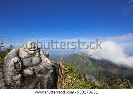 Sangkat Ja Buddha on the mountain with Twilight sky background