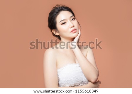 beauty woman asia and have white skin charm and brown background