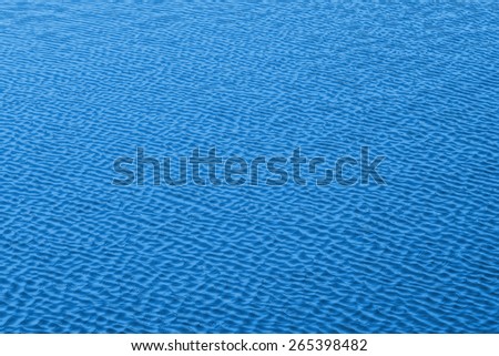 ripples on  surface of blue water