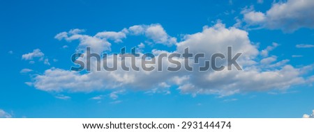 blue sky, white clouds, horizontal view,