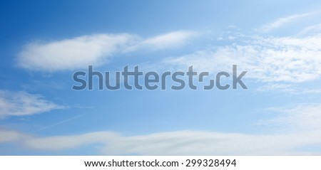Sky panorama for web sites and design. Blue sky and white clouds, soft image.