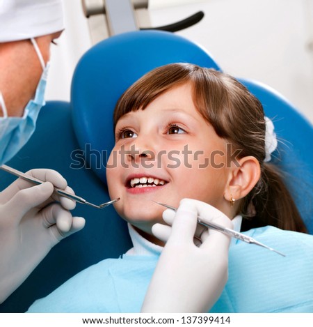 girl with a doctor in a dental office
