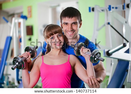 man and  woman goes in for sports in sport hall
