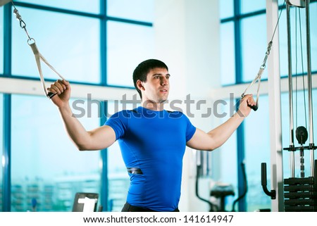 man goes in for sports in sport hall