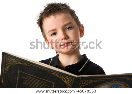 The boy reading the book on the isolated background