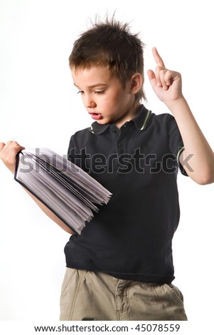 The boy reading the book on the isolated background