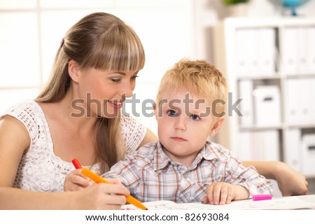 child and his mother teaches lessons