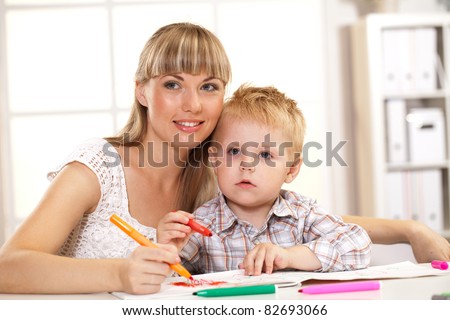 child and his mother teaches lessons