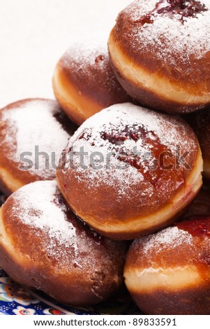 Jewish holiday baking donuts with syrup