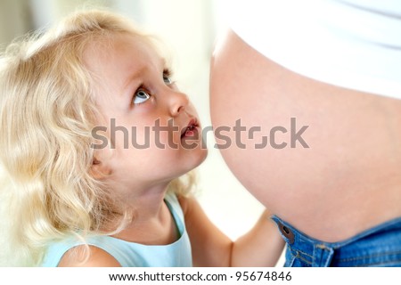 young mother teaches future baby