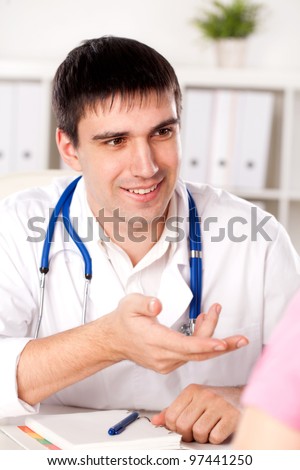 physician measures the pulse of the patient
