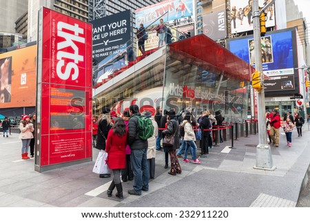 NEW YORK CITY, USA - NOVEMBER 20, 2014 : People buying ticket and looking for shows in TKTS discount ticket booth for Broadway shows of Theatre Devolopment Fund in Times Square New York City.