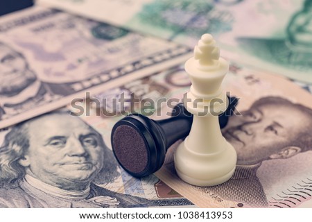 US and China finance trade war concept, black loser and white winner chess king on US dollar and china yuan banknotes, world major market countries.