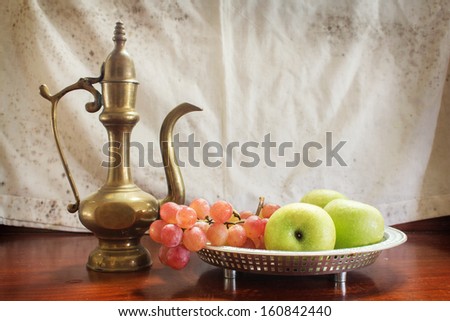 Fruit tray and drinks jug.