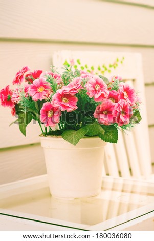 flowers in white vase,vintage style color.