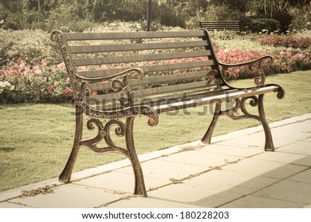 Metal bench in park,vintage style light.