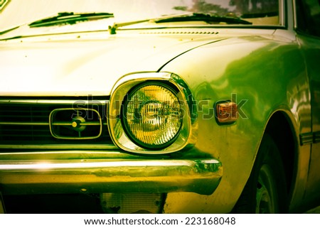 Headlight of retro car,vintage filtered