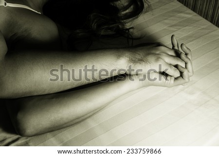 Man and woman hand in sex relationship on bed.