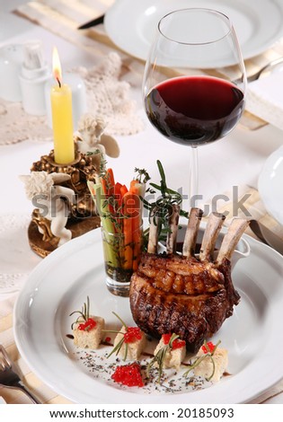 Dinner in restaurant with flaming candle and wine