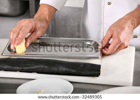 Chief grease butter baking sheet on kitchen