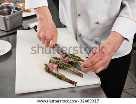 Chief cutting fried lamb rib with herb and spice