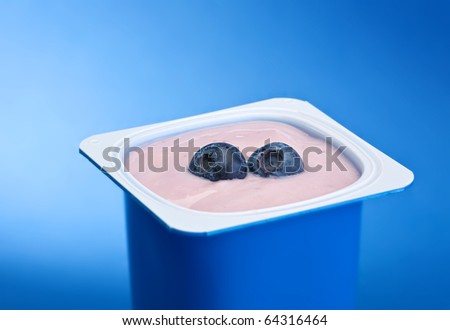Yogurt with blueberry in blue plastic box
