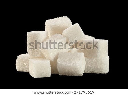 White sugar heap cube isolated on black