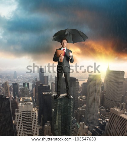 Agent on a skyscraper. Concept of insurance protection