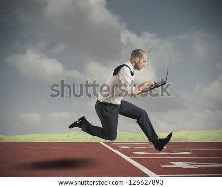 Challenge in business with running businessman with laptop
