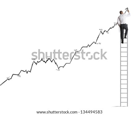 Businessman draws prevision of statistics Businessman draws prevision of statistics