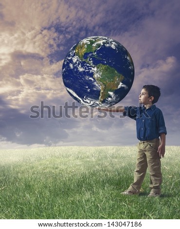 Young boy holds the word. Concept of save the world