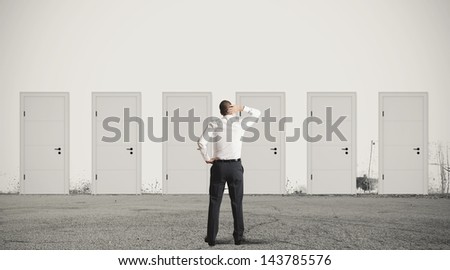 Concept Of Businessman Choosing The Right Door