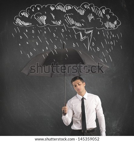 Concept of difficulty in business with umbrella