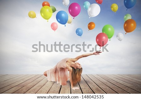 Young girl dance with colorful balloons
