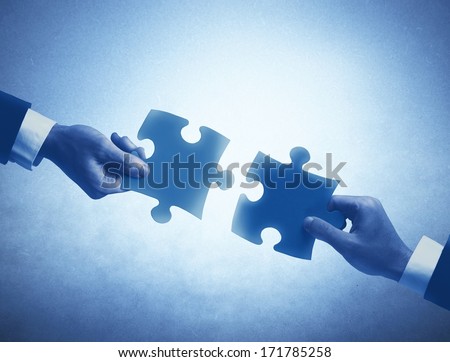Concept of business teamwork and integration with puzzle