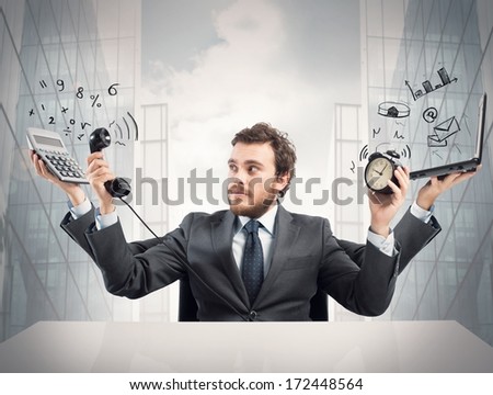 Concept Of Busy Multitasking Businessman At Work