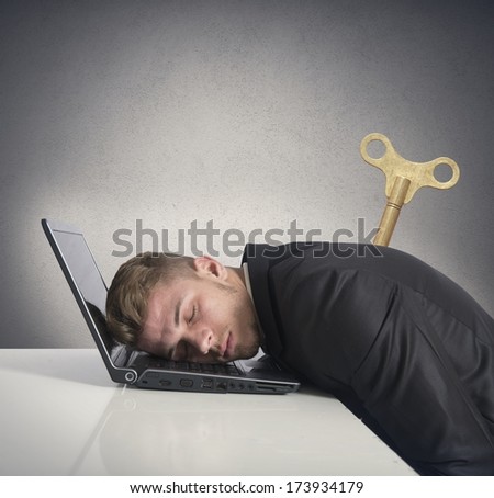 Discharge businessman that sleeps on a desk