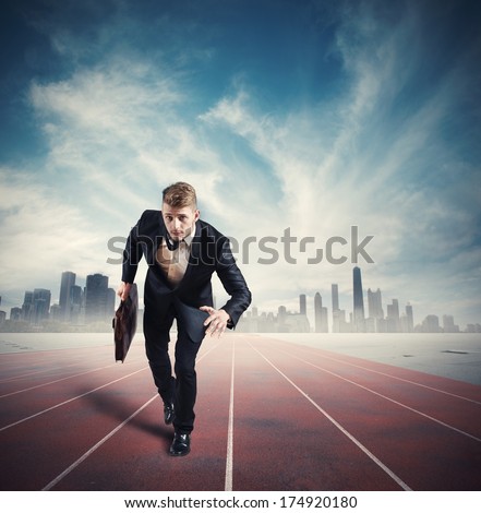 Business competition with running businessman in the racetrack