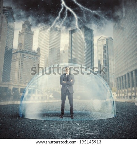 Businessman protected from the crisis with a crystal ball