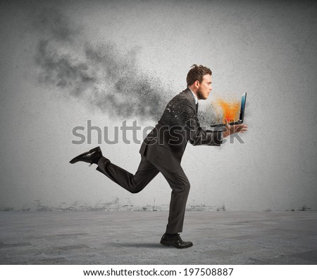 Concept of stress with running businessman with a burning laptop