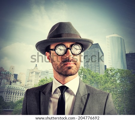 Concept of time addicted with clock on glasses of a businessman