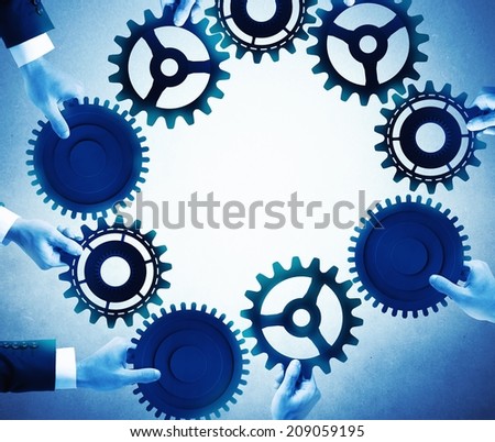 Teamwork and integration concept with businesspeople that holds gears