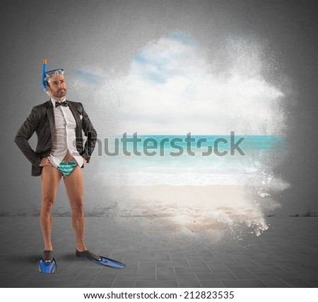 Businessman  dreams holidays dress with fins and mask