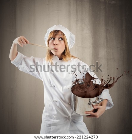 Young girl chef with chocolate in a pot