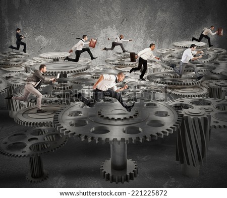 Business people running over a mechanism system