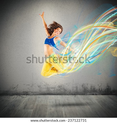 Dancer jumps leaving a strip of colors
